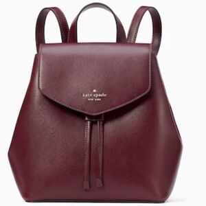 15. Kate Spade Lizzie Medium Flap Backpack in Deep Berry